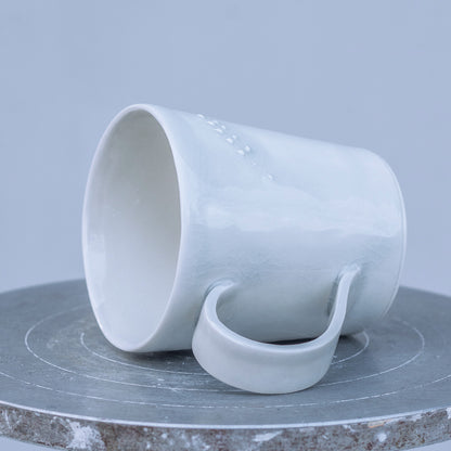 Porcelánový hrnek 250ml / šedomodrý s plastickým kláskem